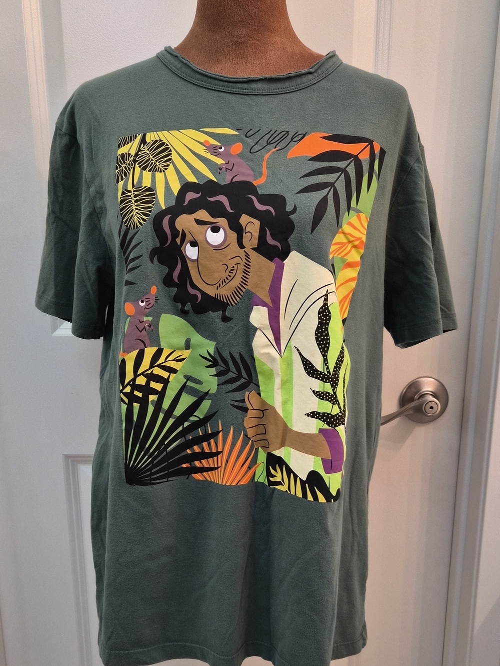 Disney Men's Green Short-Sleeve Tee with Colorful Jungle Character Print.